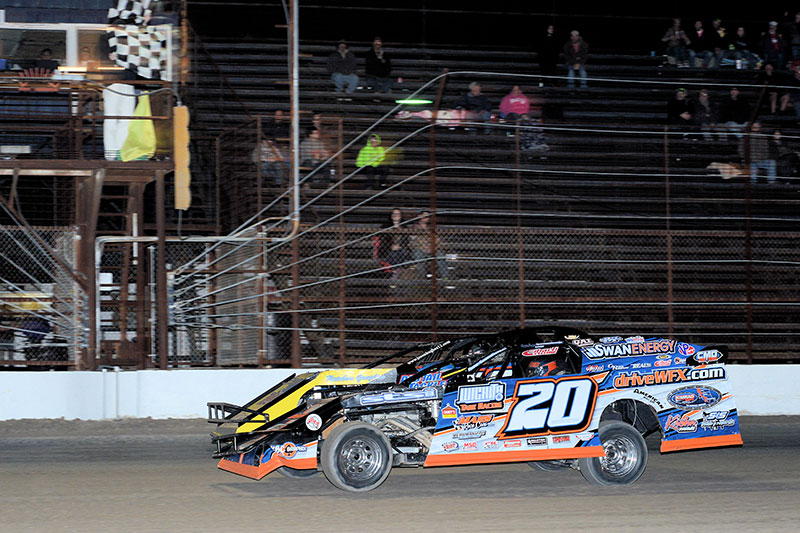 Rodney Sanders (20) beats Jason Hughes (12) to the finish line by a nose at the Shady Oaks Speedway on Thursday, Feb. 11. (Carey Akin Photo)