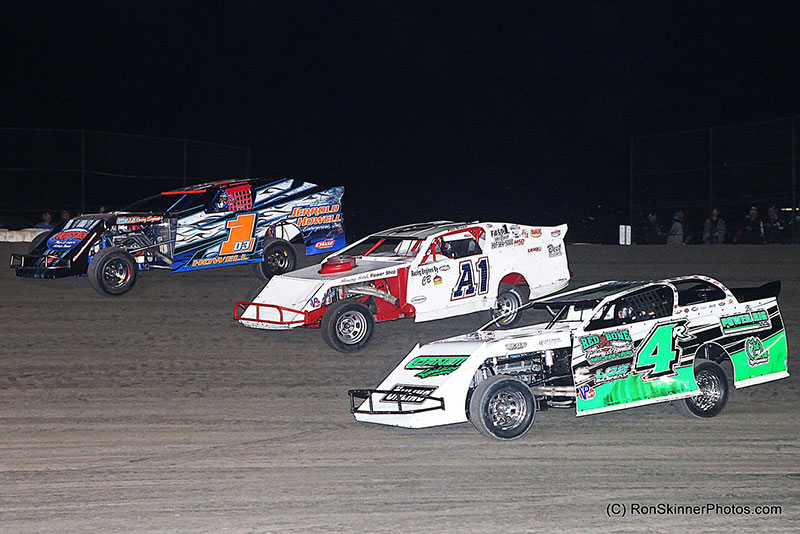 Battle between J.C. Howell (103), Phil Dixon (A1) and Dereck Ramirez (4R) on night 3 of 3 at the 7th Annual Day Motor Sports Texas Spring Nationals at the Heart O' Texas Speedway in Elm Mott, Texas.