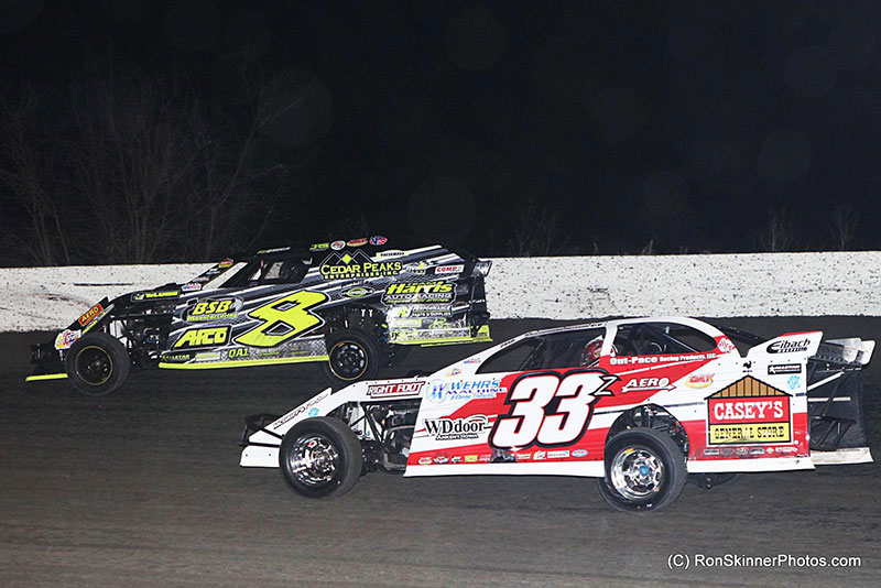 Kyle Strickler (8) fends off Zack VanderBeek early in the main event on night 3 of 3 at the 7th Annual Day Motor Sports Texas Spring Nationals at the Heart O' Texas Speedway in Elm Mott, Texas.