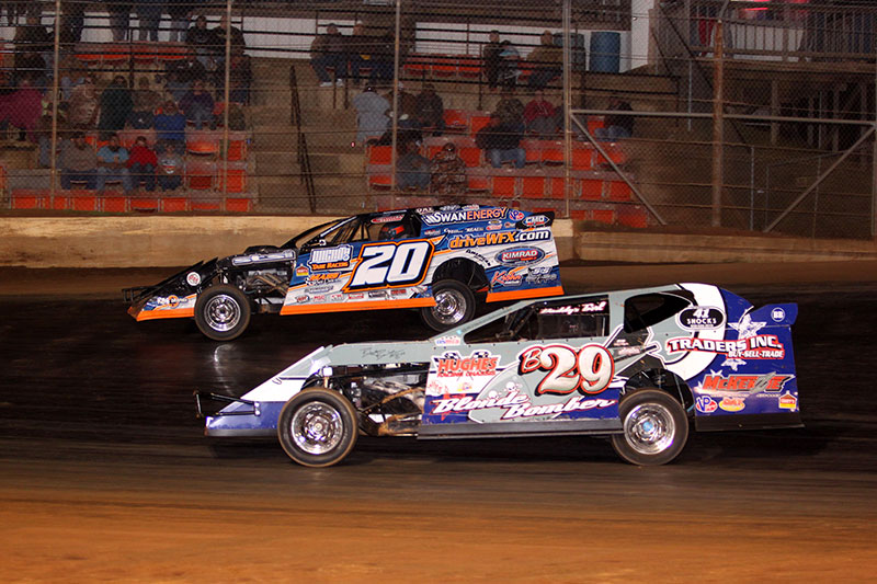 Rodney Sanders works the outside line around Blonde Bomber Mitchell on night 3 of 3 of 5th Annual Cajun Clash presented by Horseshoe Bossier City at the Ark-La-Tex Speedway in Vivian, La. (Scott Burson Photo)