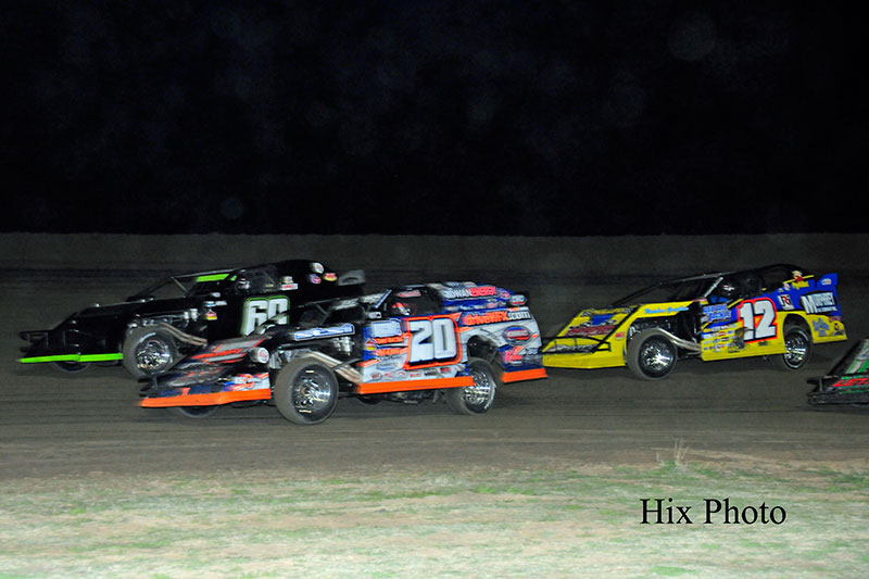 Lucas Schott (69), Rodney Sanders (20) and Jason Hughes (12) during USMTS Winter Speedweeks at the Southern Oklahoma Speedway in Ardmore, Okla.