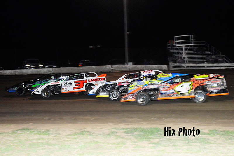 Scott Drake (7d), Mickey Lassiter (34), Casey Arneson (2), Ronnie Gould III (38) and Tyler Wolff (4W) battle five wide during USMTS Winter Speedweeks at the Southern Oklahoma Speedway in Ardmore, Okla.