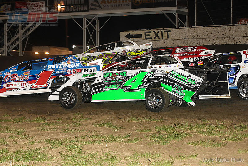 Tyler Peterson (1), Jake Gallardo (17), Dereck Ramirez (4r), Casey Arneson (2) and Chase Sigg (hidden) race close on opening night of King of America VI presented by Chix Gear at the Humboldt Speedway in Humboldt, Kan., on Thursday, March 31, 2016.