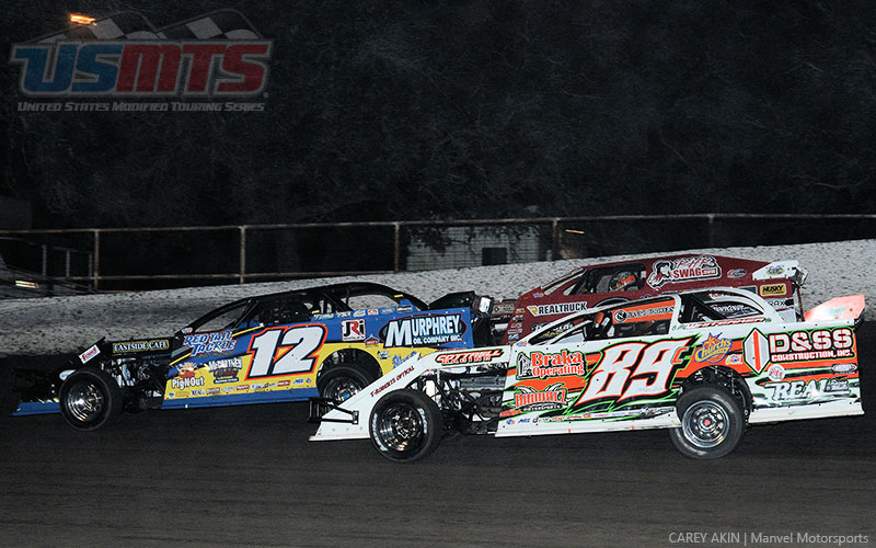 Jason Hughes (12) leads Travis Saurer (outside) and Steve Whiteaker Jr. (89) in the main event during the Summit Racing USMTS Southern Region event at the Shady Oaks Speedway in Goliad, Texas, on Friday, Feb. 17, 2017.
