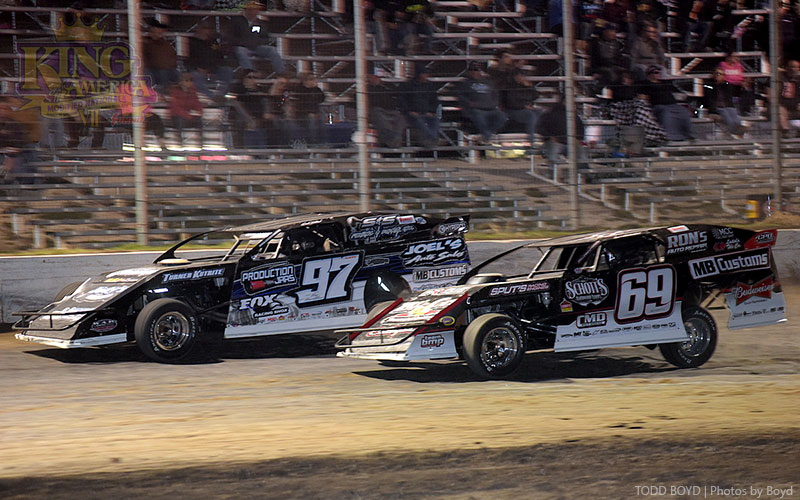Cade Dillard (97) held off Lucas Schott (69) for the runner-up finish during the King of America VII Modified Nationals presented by Summit Racing at the Humboldt Speedway in Humboldt, Kan., on Thursday, March 23, 2017.