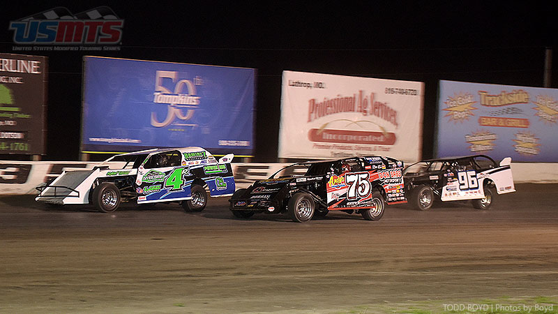 Dereck Ramirez (4r), Terry Phillips (75) and R.C. Whitwell (96) race down the back-stretch during the 9th Annual USMTS Missouri Meltdown at the I-35 Speedway in Winston, Mo., on Saturday, April 22, 2017.