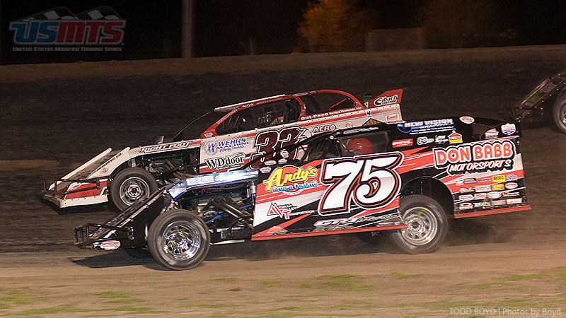 Side-by-side action between Terry Phillips (75) and Zack VanderBeek (33z) during the 9th Annual USMTS Missouri Meltdown at the I-35 Speedway in Winston, Mo., on Saturday, April 22, 2017.