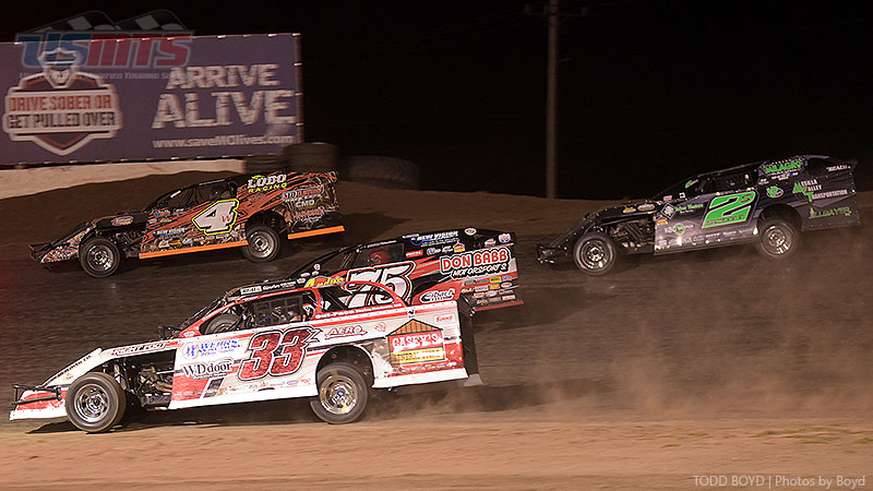 Zack VanderBeek (33z), Terry Phillips (75), Tyler Wolff (4w) and Stormy Scott (2s) race for position in the main event during the 9th Annual USMTS Missouri Meltdown at the I-35 Speedway in Winston, Mo., on Saturday, April 22, 2017.