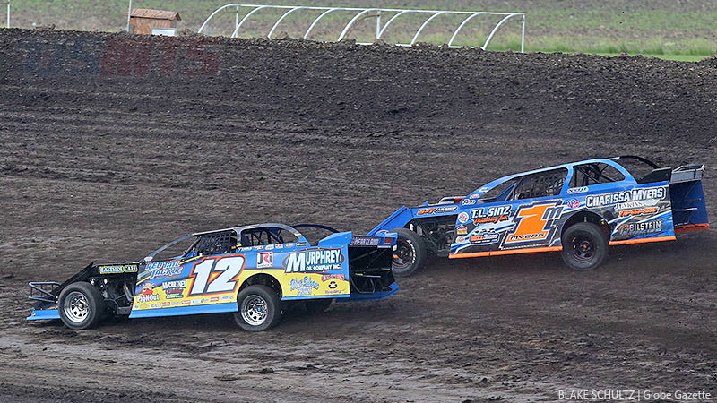 Jason Hughes (12) and Curt Myers (1m) during the 2nd Annual USMTS Diamond Jo Casino �All-In 77� at the Mason City Motor Speedway in Mason City, Iowa, on Sunday, June 11, 2017.
