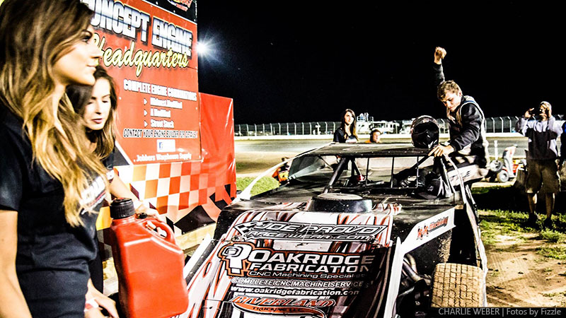 Jake Timm celebrates in victory lane after winning the 2nd Annual USMTS Chubbs Performance Midweek Modified Madness at the Ogilvie Raceway in Ogilvie, Minn., on Wednesday, June 14, 2017.