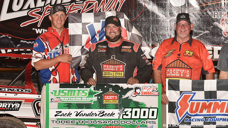 Zack VanderBeek celebrates with his father, Jim VanderBeek, and USMTS flagman Ryne Staley after winning Round #1 of the USMTS Badgerland Summer Shootout presented by Prestige Custom Cabinetry at the Luxemburg Speedway in Luxemburg, Wis., on Tuesday, July 11, 2017.