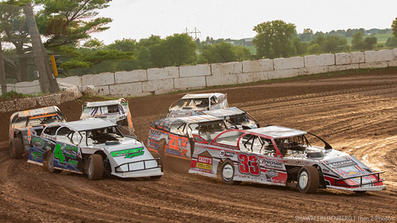 Zack VanderBeek (33z) and Dereck Ramirez (4r) lead the pack to the green flag in a heat race during Round #2 of the USMTS Badgerland Summer Shootout presented by Prestige Custom Cabinetry at the 141 Speedway in Francis Creek, Wis., on Wednesday, July 12, 2017.