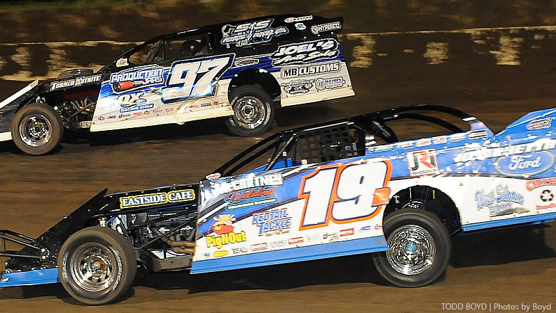 Ryan Gustin (19r) and Cade Dillard (97) battle for the lead during the 7th Annual Silver Dollar Nationals at the I-80 Speedway in Greenwood, Neb., on Saturday, July 22, 2017.