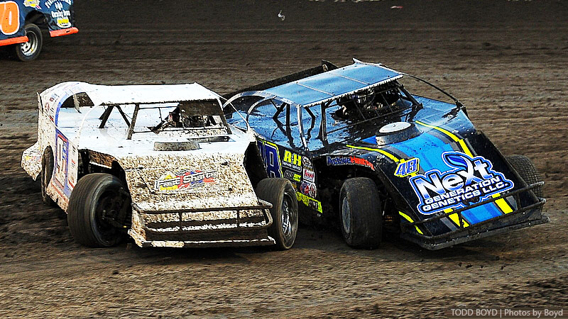 Joe Duvall (91) and Brent Dutenhoffer (48) fight for position during the 7th Annual Silver Dollar Nationals at the I-80 Speedway in Greenwood, Neb., on Friday, July 21, 2017.
