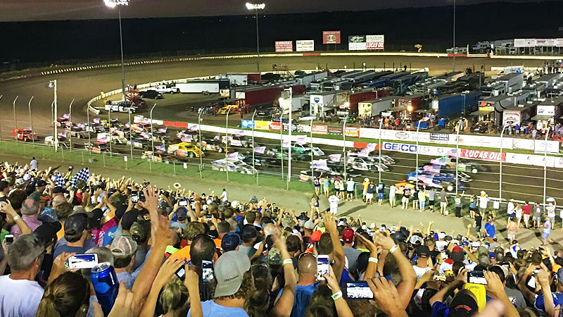 A full house cheers on the USMTS drivers during their four-wide parade lap during the 7th Annual Silver Dollar Nationals at the I-80 Speedway in Greenwood, Neb., on Saturday, July 22, 2017.