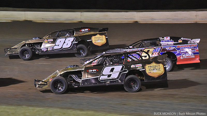 Joe Duvall (91) attempts to slide in between teammates John Allen (98) and Even Hubert (9) during the 19th Annual Featherlite Fall Jamboree at the Deer Creek Speedway in Spring Valley, Minn., on Friday, Sept. 22, 2017.