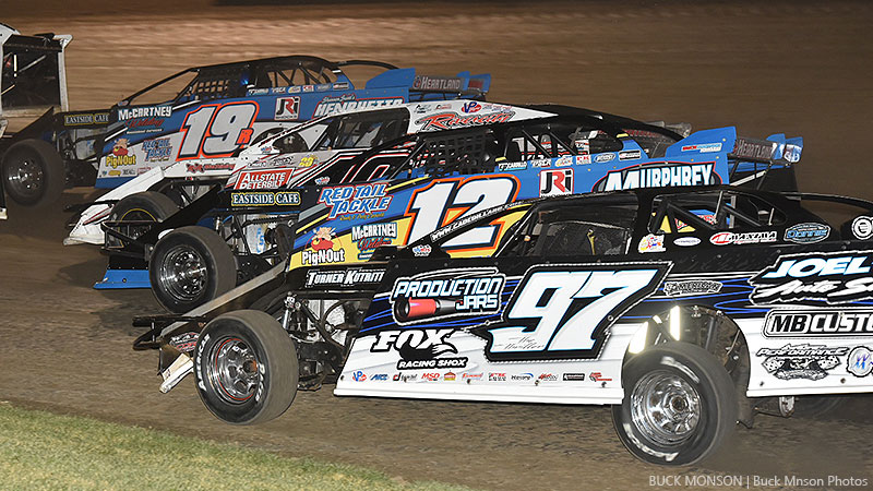Racing four-wide out of the fourth turn are Ryan Gustin (19r), Jake Timm (49), Jason Hughes (12) and Cade Dillard (97) during the 19th Annual Featherlite Fall Jamboree at the Deer Creek Speedway in Spring Valley, Minn., on Friday, Sept. 22, 2017.