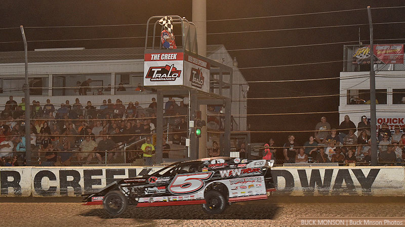 Jon Mitchell takes the checkered flag to win the USMTS Non-Qualifiers Race during the 19th Annual Featherlite Fall Jamboree at the Deer Creek Speedway in Spring Valley, Minn., on Saturday, Sept. 23, 2017.