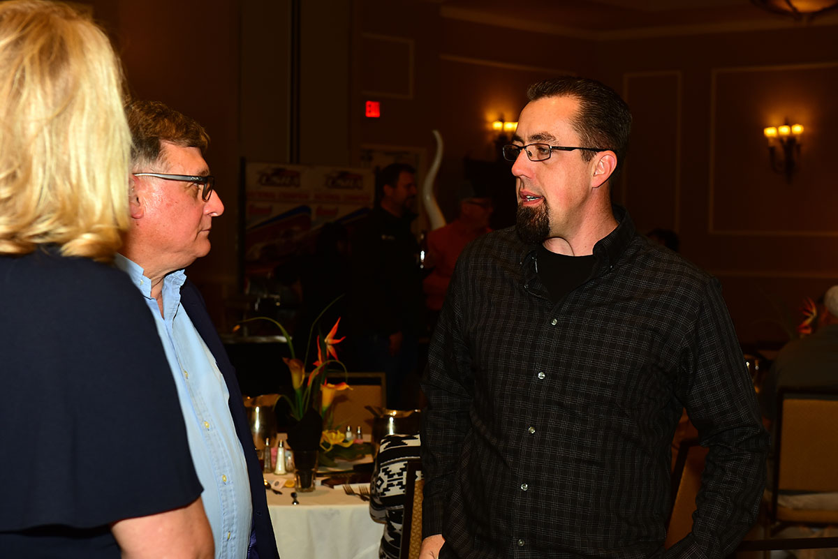 Darron Fuqua (right) chats with the owner of PEM Racing Products.