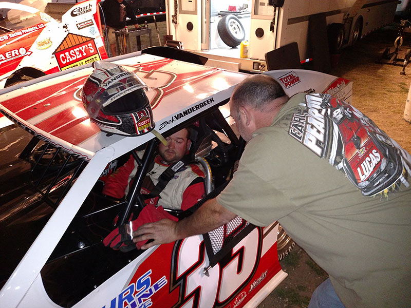 Zack VanderBeek chats with crew chief Danny Powers as he gets ready to turn some practice laps at the Heart O' Texas Speedway.