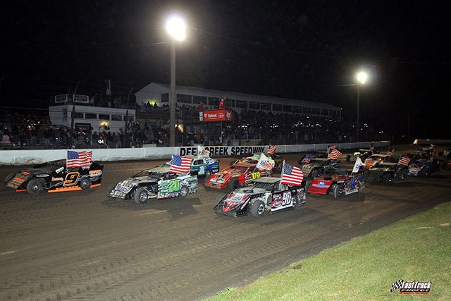 Three-wide start for the 14th Annual Featherlite Fall Jamboree at the Deer Creek Speedway. On the front row: Steve Wetzstein, Bryan Rowland and Shane Hebert.
