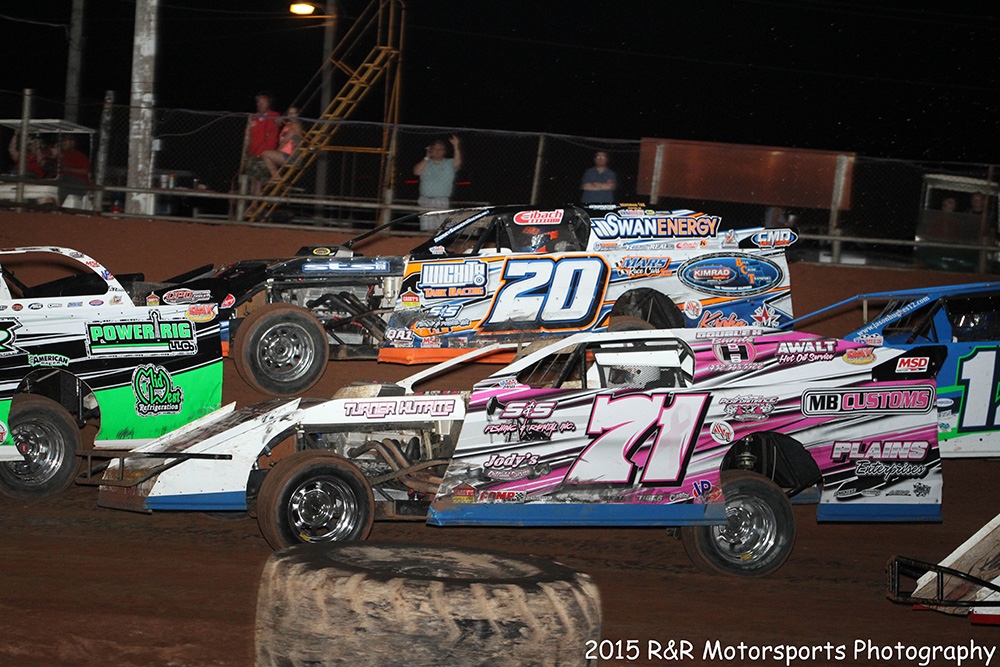Philip Houston (71) and Rodney Sanders (20) in heavy traffic during the USMTS event on Saturday, June 27, 2015, at the Lawton Speedway in Lawton, Okla.