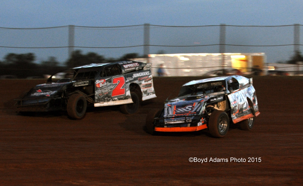Grant Junghans (2) tries to hold off Rodney Sanders (20) in Edelbrock Heat Race #3 during the USMTS event on Saturday, June 27, 2015, at the Lawton Speedway in Lawton, Okla.