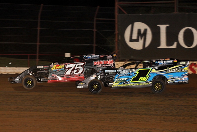 Terry Phillips (75) and Jeremy Payne (186) battle for the lead during the 5th Annual Lucas Slick Mist Show-Me Shootout at the Lucas Oil Speedway in Wheatland, Mo., on Saturday, Aug. 9. (Chris Bork Photo)