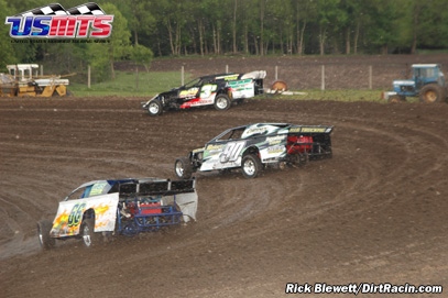 Tim Donlinger (3d), Steve Wetzstein (90) and Don Bohr (66) power through turn 1 at Chateau Raceway. 