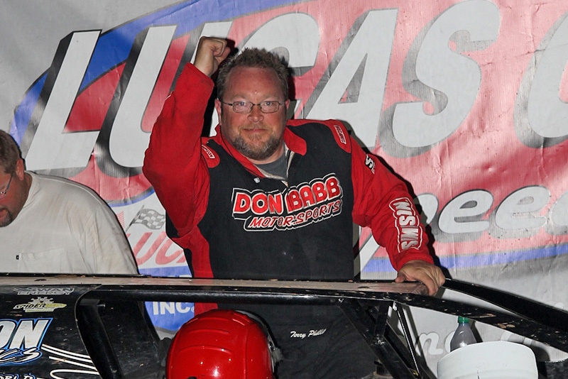 Terry Phillips celebrates after winning the 5th Annual Lucas Slick Mist Show-Me Shootout at the Lucas Oil Speedway in Wheatland, Mo., on Saturday, Aug. 9. (Chris Bork Photo)