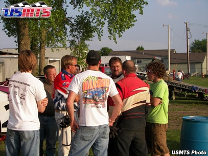 Corey Dripps (back facing camera) talks with Al Hejna while USMTS promoter Todd Staley listens in. 
