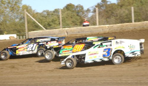 Sunday afternoon action with Jim Horejsi (21), Steve Wetzstein (90) and Kelly Shryock (3). (Neil Eric Miller Photo) 