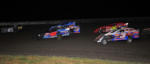 Tommy Myer (65), Chase Junghans (18), Greg Jensen (hidden, middle), Jason Hughes (hidden, outside), Kelly Shryock (3) and Bob Gierke (26) in heat race action during the 15th Annual Featherlite Fall Jamboree at the Deer Creek Speedway. (Lloyd Collins Photo)