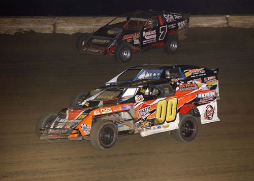 Steve Arpin (00) passes Jim Horejsi (21) for the lead while Al Hejna (7) uses the high side to make his move on the frontrunners. (Neil Eric Miller Photo) 