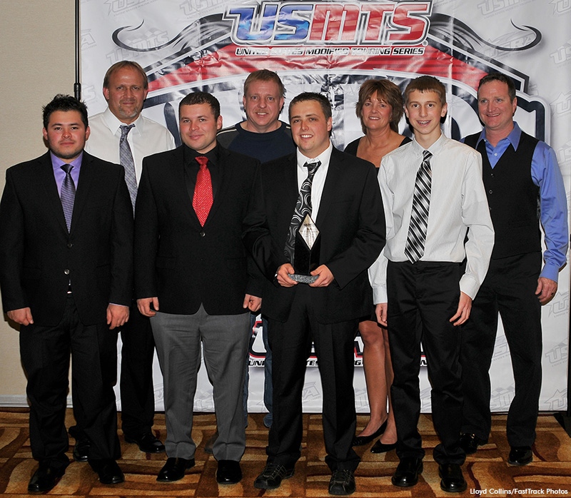 Several drivers who competed in the Hunt for the USMTS Casey�s National Championship in 2013 gathered for a photo at the USMTS awards banquet on Friday, Jan. 31, 2014. From left to right: Johnny Scott, USMTS president Todd Staley, Stormy Scott, Kelly Shryock, Rodney Sanders, USMTS vice president Janet Staley, Trevor Hunt and Pat Graham. (Lloyd Collins, FastTrack Photos)