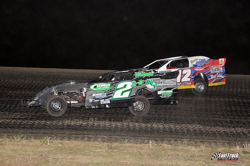 Stormy Scott (2s) passes Jason Hughes (12) to take over third in the feature race. (Lloyd Collins Photo)