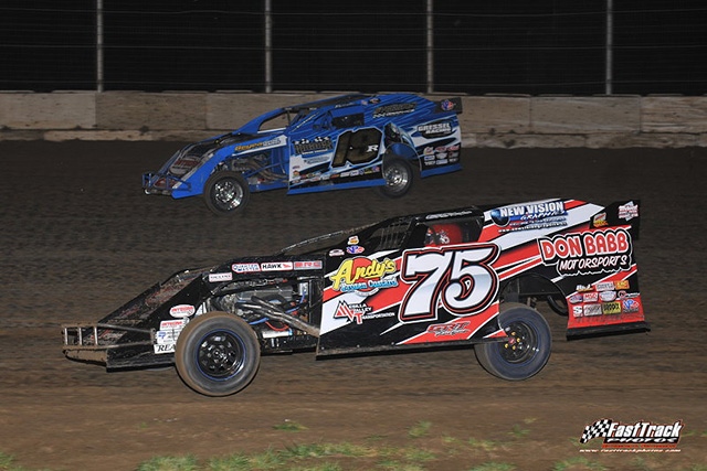 Terry Phillips (75) led the first 25 laps before Ryan Gustin (19r) used lapped traffic to take command of the main event.