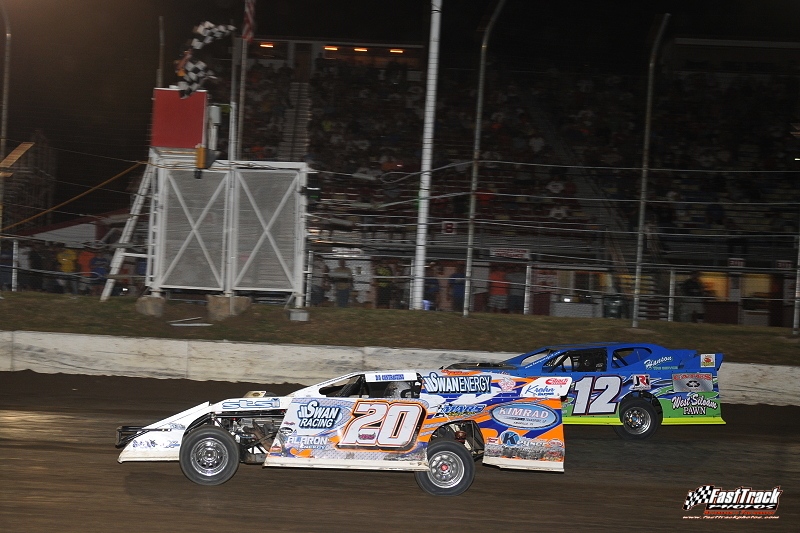 Rodney Sanders (20) holds off Jason Hughes at the finish line to win the opening night of the Silver Dollar Nationals at the I-80 Speedway.
