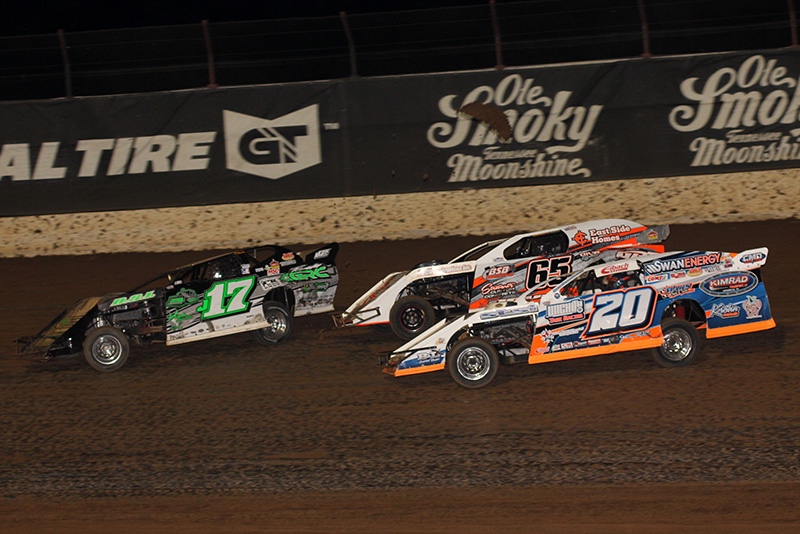 Jake Gallardo (J17), Tyler Davis (65) and Rodney Sanders (20) battle in the main evnet during the 5th Annual Lucas Slick Mist Show-Me Shootout at the Lucas Oil Speedway in Wheatland, Mo., on Saturday, Aug. 9. (Chris Bork Photo)