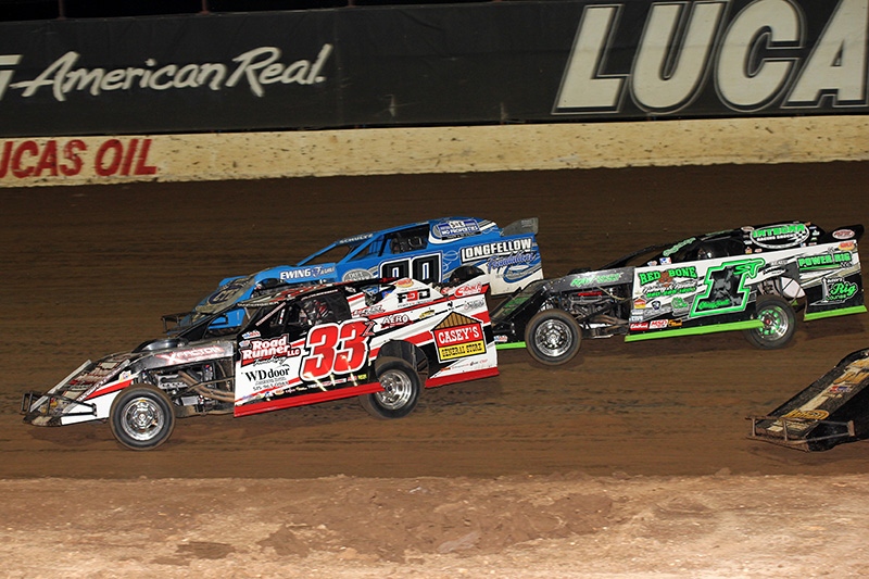 Zack VanderBeek (33z), Terry Schultz (90) and Johnny Scott (1st) battle in the main event during the 5th Annual Lucas Slick Mist Show-Me Shootout at the Lucas Oil Speedway in Wheatland, Mo., on Saturday, Aug. 9. (Chris Bork Photo)