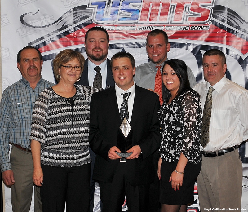 Rodney Sanders and his team were honored at the USMTS awards banquet Friday night. From left to right: Rodney's parents Marcus and Cheryl Sanders, team owner Brandon Davis of Swan Racing, 2013 USMTS national champion Rodney Sanders, crew chief Grant Snider, girlfriend Samantha Krohn and teammate Jason Krohn who won the 2007 USMTS national title. (Lloyd Collins, FastTrack Photos).