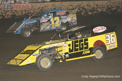Kenny Wallace (36) and Jason Hughes (12) fight for position in the main event. 